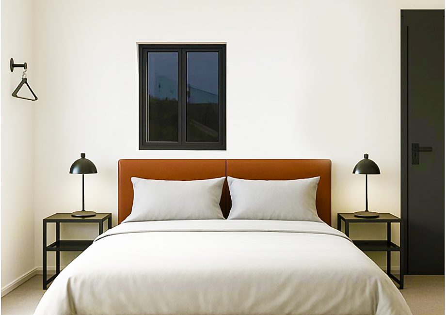 Bedroom in Cabin 4 opposite a terrace with views of the Shipyard and Grand Harbour.